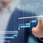 Project manager updating tasks and milestones progress planning with Gantt chart scheduling interface on a virtual screen